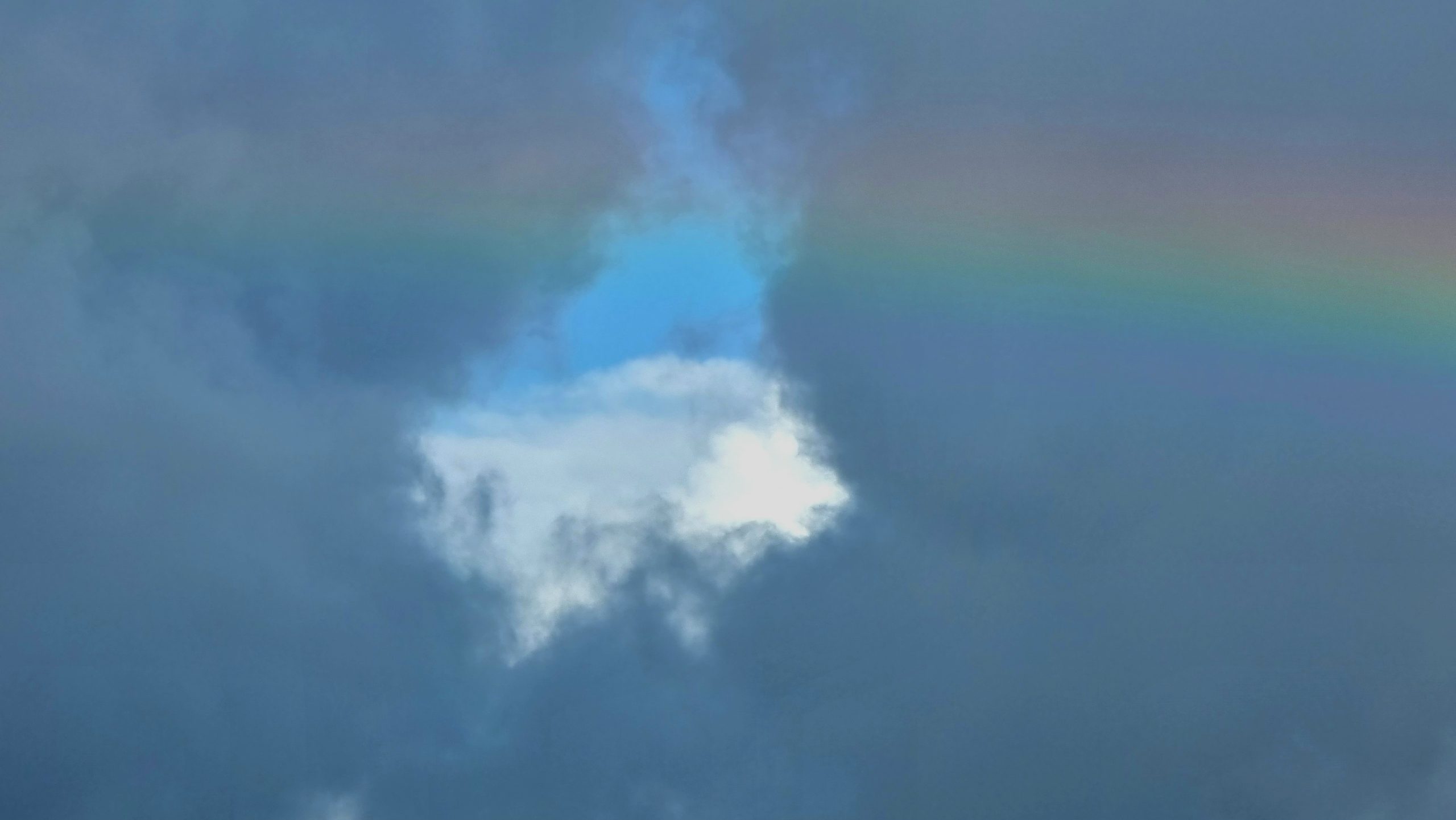 Rainbow against dark clouds